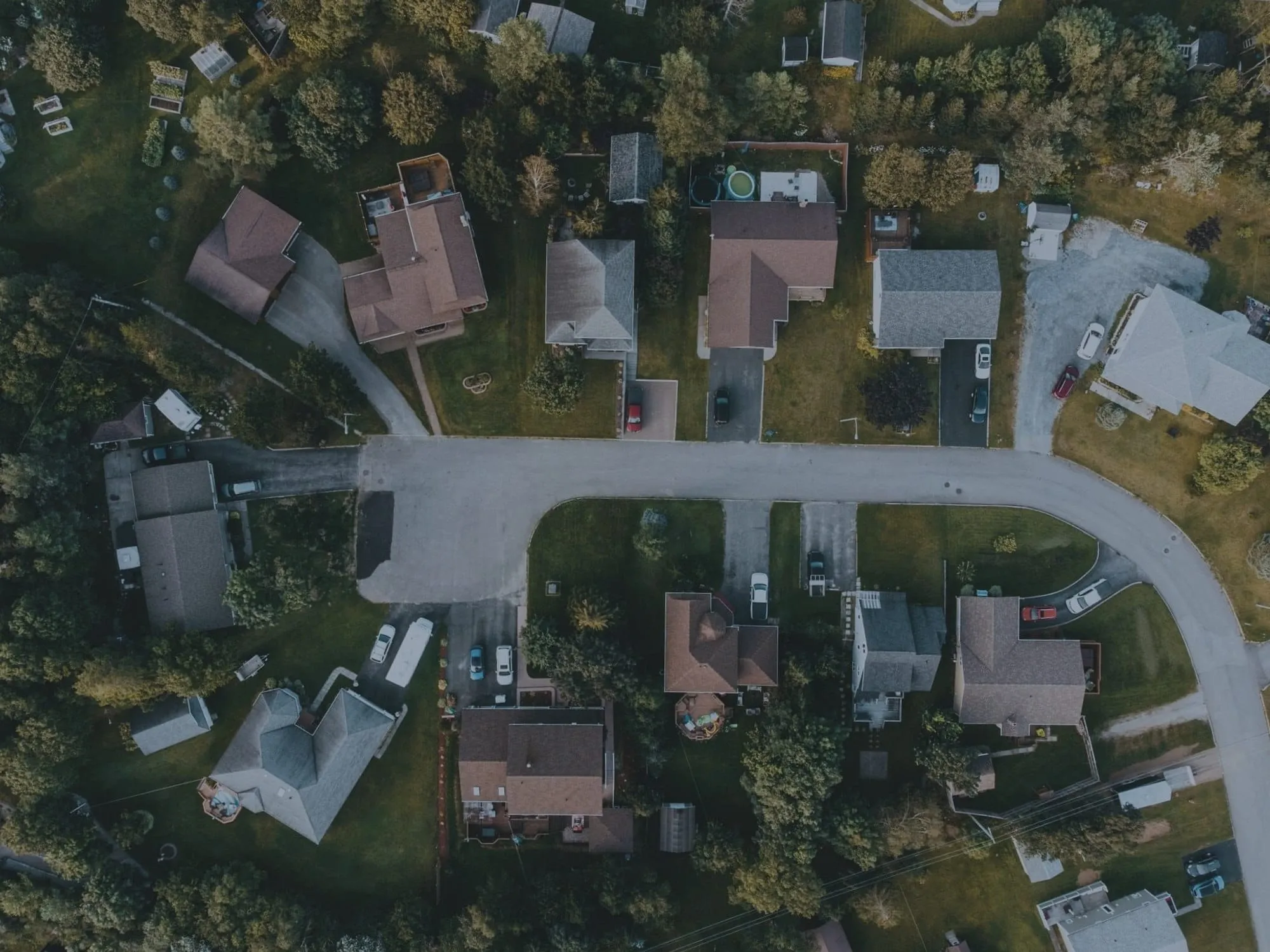 Top-down aerial of homes, before editing