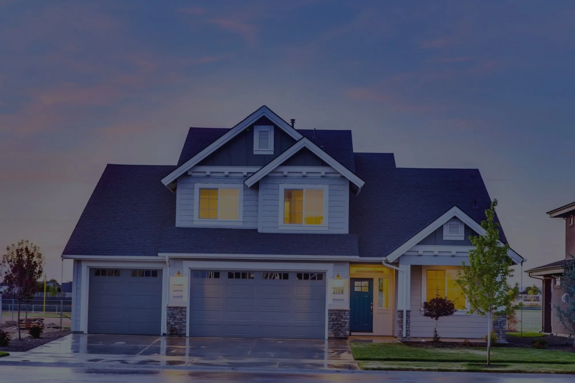 Craftsman home at dusk, before editing